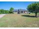 Charming brick home featuring a welcoming front porch and well-maintained landscaping at 118 Sir Gregory Dr, Shelby, NC 28152