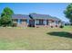 Charming brick home featuring a welcoming front porch and well-maintained landscaping at 118 Sir Gregory Dr, Shelby, NC 28152
