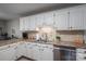Kitchen sink area with stainless steel dishwasher, tile backsplash and ample counter space at 118 Sir Gregory Dr, Shelby, NC 28152