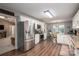 Spacious kitchen features stainless steel appliances, white cabinetry, and hardwood floors at 118 Sir Gregory Dr, Shelby, NC 28152