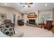 Cozy living room features a brick fireplace and plush seating at 118 Sir Gregory Dr, Shelby, NC 28152