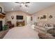 Cozy living room features a fireplace, plush carpet, and a vaulted ceiling with a ceiling fan at 118 Sir Gregory Dr, Shelby, NC 28152