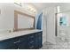 Charming bathroom featuring a double vanity, marble countertop, decorative floor tiles, and toilet at 121 Northampton Dr, Mooresville, NC 28117