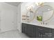 Stylish bathroom features double vanity with gray cabinets, gold accents, and two round mirrors at 121 Northampton Dr, Mooresville, NC 28117