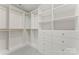 Spacious walk-in closet with custom white shelving and drawers, offering ample storage space at 121 Northampton Dr, Mooresville, NC 28117