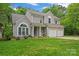 Charming two-story home featuring gray siding, well-manicured lawn, and a two-car garage at 121 Northampton Dr, Mooresville, NC 28117
