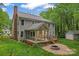 View of the exterior featuring a backyard patio, screened-in porch, and garden space perfect for entertaining at 121 Northampton Dr, Mooresville, NC 28117