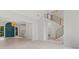 Bright foyer featuring a modern staircase with wood and metal railings, with an open view to other rooms at 121 Northampton Dr, Mooresville, NC 28117