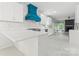Modern kitchen featuring white cabinetry, a custom hood, and stainless steel appliances at 121 Northampton Dr, Mooresville, NC 28117