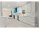 Updated kitchen with white cabinets, stainless appliances, and white countertops at 121 Northampton Dr, Mooresville, NC 28117