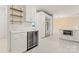 Modern kitchen area featuring a wine fridge, white cabinets, and stainless steel appliances at 121 Northampton Dr, Mooresville, NC 28117