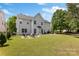 Spacious backyard with a fire pit area, outdoor seating, and a well-maintained lawn at 1210 Langdon Terrace Dr, Indian Trail, NC 28079