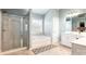 Bright bathroom featuring a tiled floor, walk-in shower, and a soaking tub at 1210 Langdon Terrace Dr, Indian Trail, NC 28079