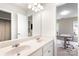 Bathroom featuring double sink vanity, and views to office space and closet at 1210 Langdon Terrace Dr, Indian Trail, NC 28079