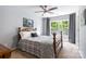 Bedroom features light gray walls, a wooden framed bed, and a large window with natural light at 1210 Langdon Terrace Dr, Indian Trail, NC 28079