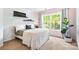 Cozy bedroom with large window, gray accents, a queen size bed, and decor at 1210 Langdon Terrace Dr, Indian Trail, NC 28079