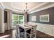 Bright dining room with a large window, stylish table setting, and elegant chandelier at 1210 Langdon Terrace Dr, Indian Trail, NC 28079