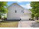 Side exterior with an attached garage and well maintained lawn and driveway at 1210 Langdon Terrace Dr, Indian Trail, NC 28079