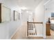 Hallway with stairway, carpet, and art displayed on the wall leading to the bedrooms at 1210 Langdon Terrace Dr, Indian Trail, NC 28079
