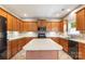 Open kitchen featuring an island, tile backsplash, and stainless steel appliances at 1210 Langdon Terrace Dr, Indian Trail, NC 28079