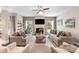 Bright living room with fireplace, built-in shelves, and large windows letting in natural light at 1210 Langdon Terrace Dr, Indian Trail, NC 28079