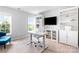 Bright office space featuring desk, shelves, chair, large window, and view to outside at 1210 Langdon Terrace Dr, Indian Trail, NC 28079