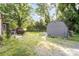 Large backyard featuring a storage shed and lush greenery at 1221 Patterson St, Shelby, NC 28152