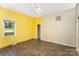 Spacious bedroom with yellow walls, and wood-look floors, offering a cozy space at 1221 Patterson St, Shelby, NC 28152
