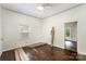 Bedroom showcasing older floors, windows and doors awaiting paint and trim at 1221 Patterson St, Shelby, NC 28152