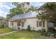 Charming home with metal roof, vinyl siding, and inviting front porch, nestled on a grassy lawn at 1221 Patterson St, Shelby, NC 28152