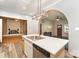 Charming kitchen featuring a large island with a stainless steel sink and a view into the living room at 1221 Patterson St, Shelby, NC 28152
