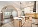 Open kitchen featuring a kitchen island and views into the living room and entry at 1221 Patterson St, Shelby, NC 28152