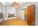 Bright living room featuring a white brick fireplace, ceiling fan, and wood flooring at 1221 Patterson St, Shelby, NC 28152