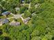 Aerial view of home nestled among trees with a backyard at 16565 Kimbolten Dr, Huntersville, NC 28078