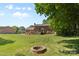 Spacious backyard with a fire pit, perfect for outdoor gatherings and relaxation at 16565 Kimbolten Dr, Huntersville, NC 28078