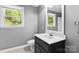 Bright bathroom featuring neutral colors, a single vanity and natural light from the window at 16565 Kimbolten Dr, Huntersville, NC 28078