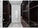 Spacious walk-in closet with custom shelving and drawers, providing ample storage at 16565 Kimbolten Dr, Huntersville, NC 28078