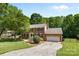 Two-story brick house with black shutters, attached garage and neatly kept lawn at 16565 Kimbolten Dr, Huntersville, NC 28078