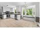 Bright kitchen equipped with stainless steel appliances, granite countertops, and a window bench at 16565 Kimbolten Dr, Huntersville, NC 28078