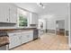 Clean kitchen with stainless steel appliances, granite countertops, and bright white cabinets at 16565 Kimbolten Dr, Huntersville, NC 28078