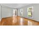 Bright living room boasting hardwood floors, natural light and neutral wall colors at 16565 Kimbolten Dr, Huntersville, NC 28078