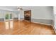 Living room featuring hardwood floors, a brick fireplace and access to the outdoors at 16565 Kimbolten Dr, Huntersville, NC 28078