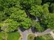 Secluded home featuring a wooded lot providing lots of shade and privacy on a corner homesite at 1750 Oak Valley Dr, Gastonia, NC 28054