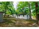 View of house with large, shaded yard and trees at 1750 Oak Valley Dr, Gastonia, NC 28054