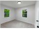 Bright bedroom featuring neutral walls, plush carpet, and windows with backyard views at 1750 Oak Valley Dr, Gastonia, NC 28054