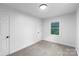 Bright bedroom featuring neutral walls, plush carpet, and a closet at 1750 Oak Valley Dr, Gastonia, NC 28054