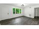 The bedroom is bright with vinyl wood floors at 1750 Oak Valley Dr, Gastonia, NC 28054
