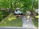 Aerial view of house with a well-maintained front yard and concrete driveway at 1750 Oak Valley Dr, Gastonia, NC 28054