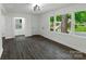The living room is bright and airy, features vinyl wood floors and large windows at 1750 Oak Valley Dr, Gastonia, NC 28054