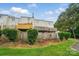 View of a fenced backyard and deck from a two-story townhome on a sunny day at 202 Water Oak Dr, Pineville, NC 28134